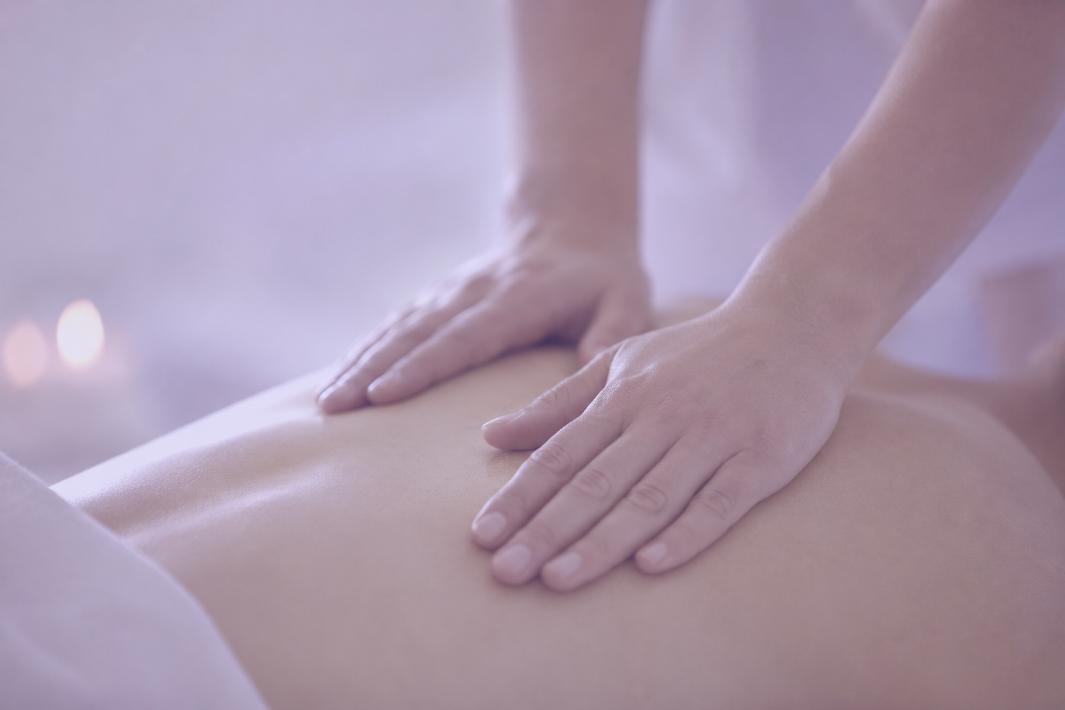 Hands performing a Swedish massage